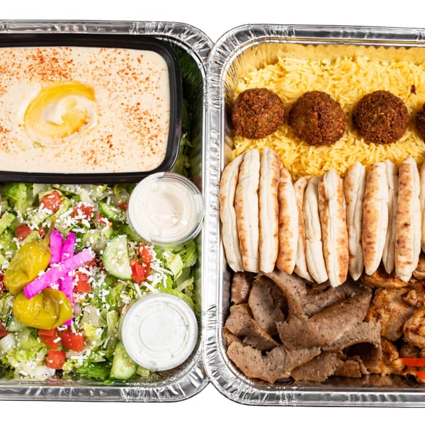 Two foil containers filled with Joe's Falafel hummus, salad, rice, falafel, pita, gyro, and chicken.